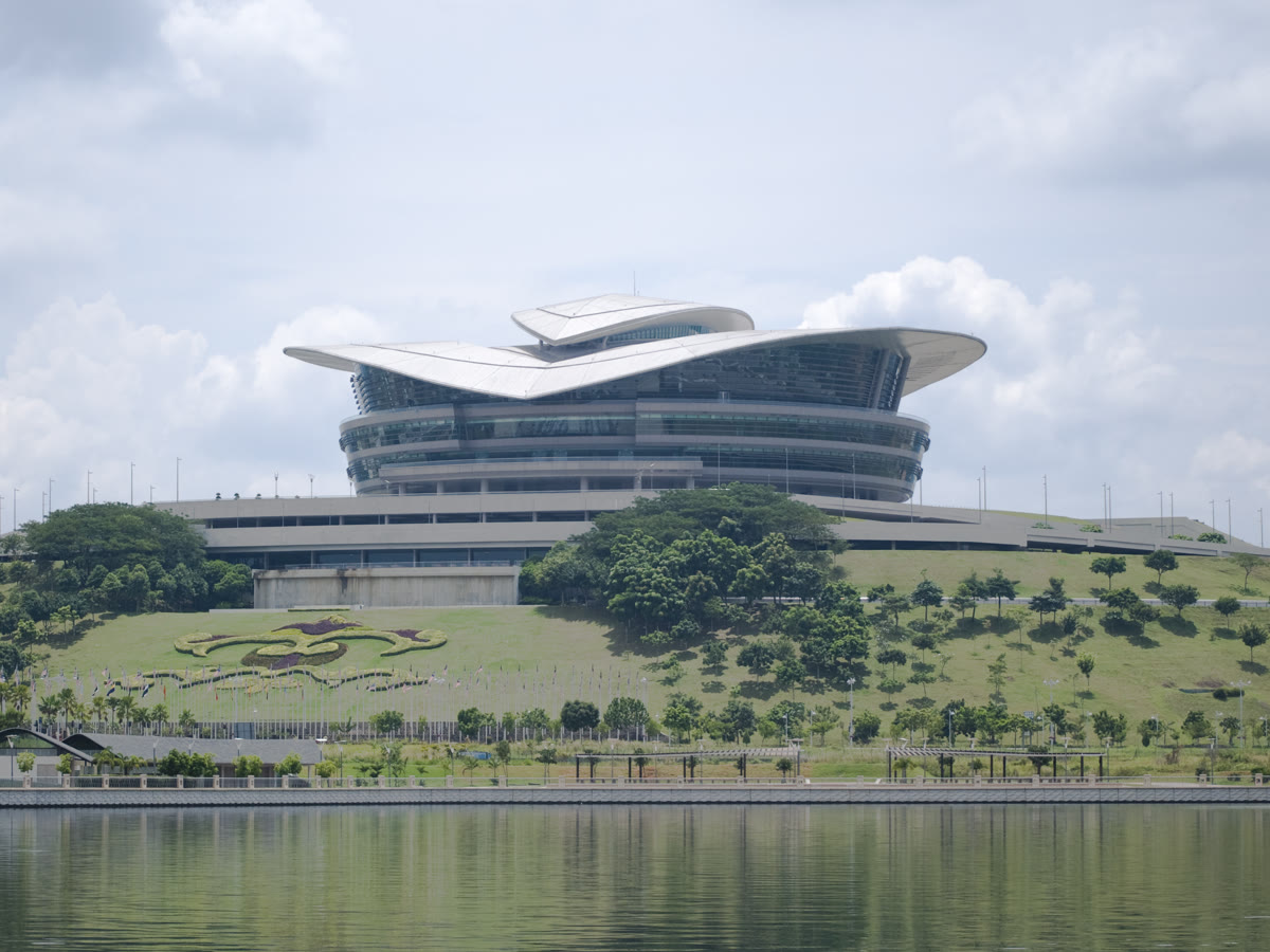 Putrajaya International Convention Centre on its hill, seen across the lake